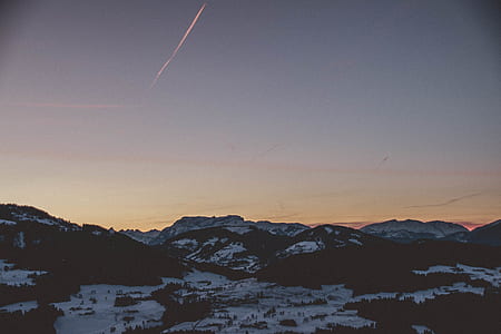 birds-eye photography of snow-covered land and mountain thumbnail