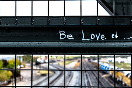 Be Love on black steel fence thumbnail