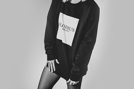 grayscale photo of woman wearing sweater thumbnail