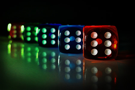 selective focus photography of five dices reflecting on surface thumbnail