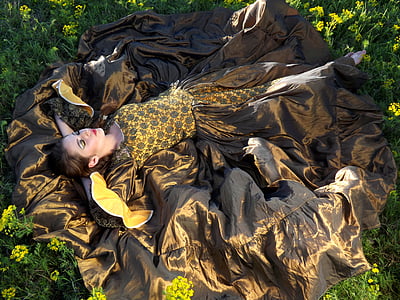 woman wearing brown and yellow floral dress thumbnail