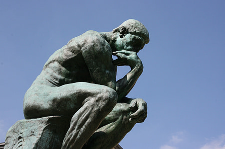 grey and white statue under blue sky thumbnail