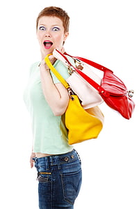woman in teal polo shirt and denim bottoms holding bags thumbnail