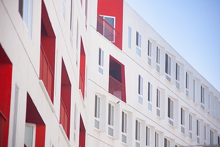 architectural photography of white and red building thumbnail