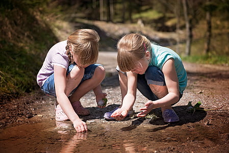 two girls crouching thumbnail