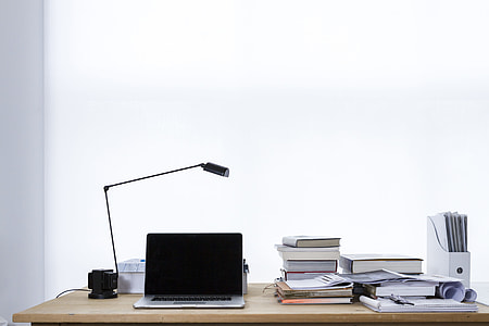black and gray laptop computer beside of black desk lamp thumbnail