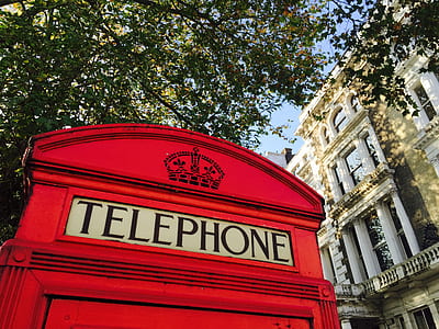 telephone booth near concrete building thumbnail