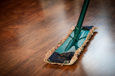 green and brown mop on brown floor parquet tile thumbnail
