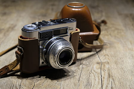 silver and brown DSLR camera in macro shot thumbnail