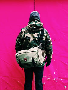 woman in woodland camouflage jacket and black pants thumbnail