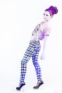 woman wearing pink and gray striped crop top and black and white houndstooth pants thumbnail