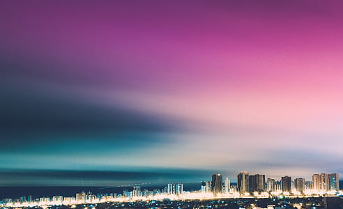 city buildings and purple and blue sky thumbnail
