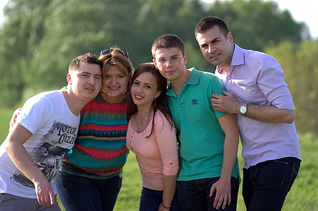 five smiling men and women at daytime thumbnail
