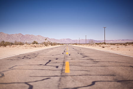 landscape photography of brown asphalt road thumbnail