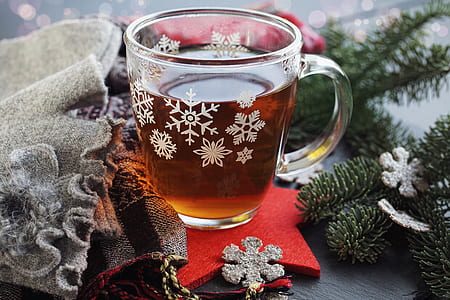 glass mug filled with liquid on red star decor thumbnail