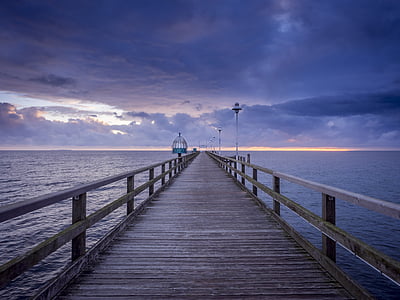 brown wooden boat dock during daytime thumbnail