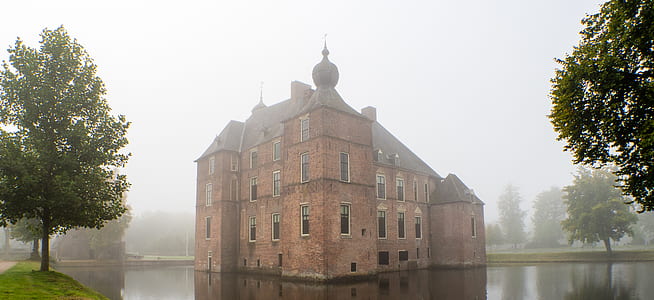 brown building in middle of bodies of water thumbnail