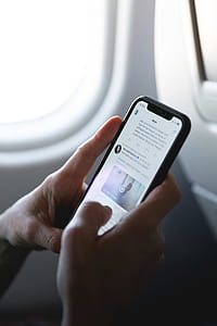 person holding space gray iPhone X thumbnail