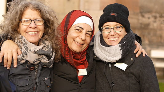 three smiling women in winter tops thumbnail