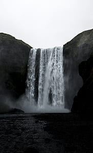 grayscale photography of waterfalls thumbnail