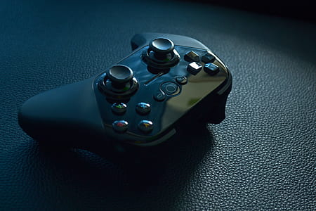 Black Wireless Game Controller on Black Leather thumbnail