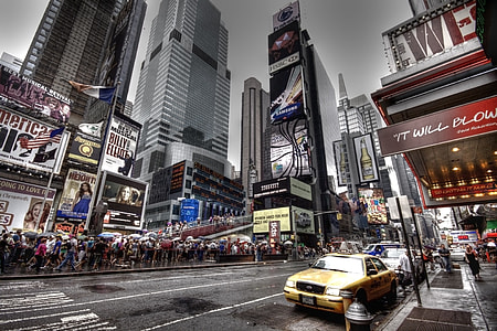 yellow taxi cab along the street at New York Times Square thumbnail