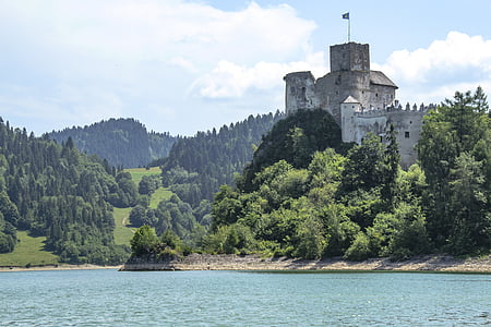 gray castle on rock by the sea thumbnail