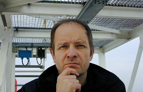 man holding his chin thumbnail