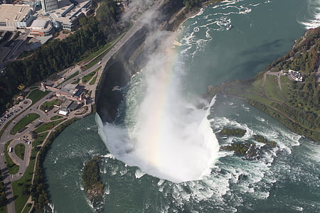aerial photo of waterfall beside concrete roads thumbnail