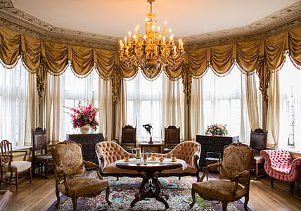 oval brown wooden table and sofa thumbnail