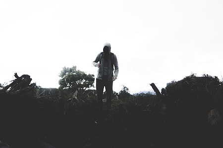 person standing on green grass ground thumbnail