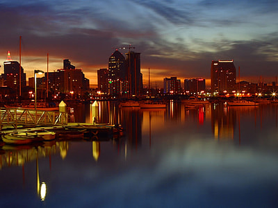 painting if body of water and high rise buildings thumbnail