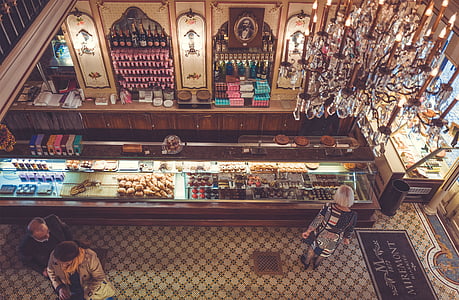 photo of woman standing in front of display counter thumbnail