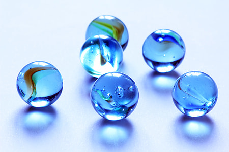 six blue translucent glass marbles thumbnail