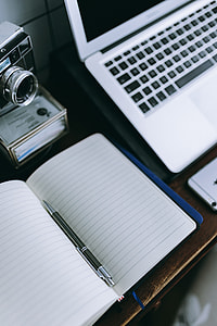 Elegant workspace with Macbook, iPhone, business cards and notebooks thumbnail