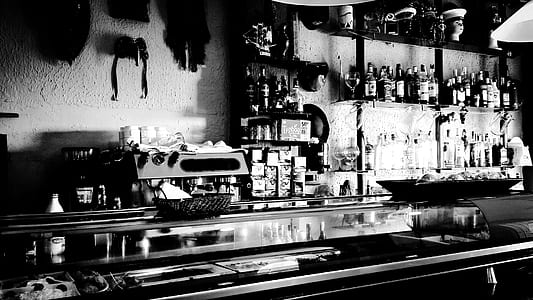 alcoholic bottles on wall shelf thumbnail