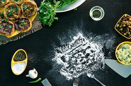 white powder on black surface beside silver spoon thumbnail