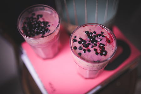 two clear drinking glass with shake and toppings thumbnail