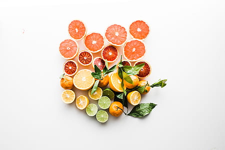 slice orange and lemon on white surface thumbnail