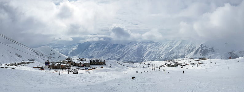 panoramic photography of town on icy mountain thumbnail