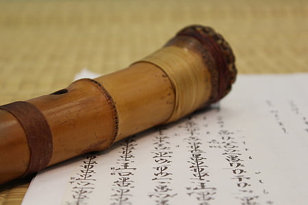 brown wooden wind instrument on paper thumbnail