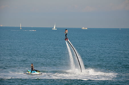 person on personal watercraft at daytime thumbnail
