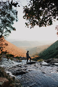 man standing on rock thumbnail