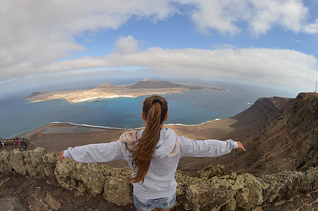 women's blue jacket taking photo thumbnail