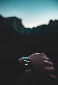 left person's arm with turned on Apple Watch with white Sport Band in selective focus photography thumbnail