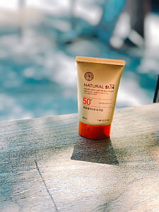 sun tan lotion, wooden table, sun cream, summer, lotion thumbnail