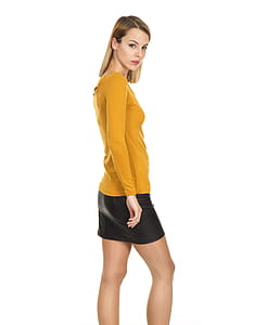 woman wearing yellow long-sleeved shirt and black tube skirt thumbnail
