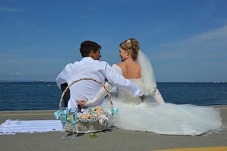 woman wearing white wedding gown and man wearing white dress shirt thumbnail