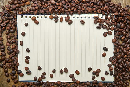 bunch of coffee beans and white notebook thumbnail