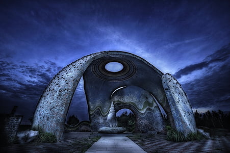 gray concrete structure under purple sky during nighttime thumbnail